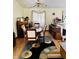 Cozy dining room with hardwood floors, an accent rug, and warm lighting at 5346 Shefford Ct, Indianapolis, IN 46254