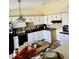 Traditional kitchen with bright white cabinets, black countertops, and a cozy breakfast nook at 5346 Shefford Ct, Indianapolis, IN 46254