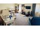 Comfortable living room with multiple seating options, a large TV, and bright accents at 5346 Shefford Ct, Indianapolis, IN 46254
