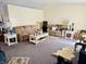 Spacious living room featuring comfortable seating, a high ceiling, and neutral decor at 5346 Shefford Ct, Indianapolis, IN 46254