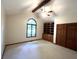 Bedroom boasting a large window, vaulted ceilings, and built-in wooden shelving at 1079 Old Eagle Way, Greenwood, IN 46143