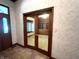 Leads to office with glass French doors and built-in shelving at 1079 Old Eagle Way, Greenwood, IN 46143