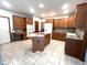 Spacious kitchen includes an island with cooktop and ample cabinet space at 1079 Old Eagle Way, Greenwood, IN 46143