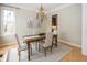 Cozy dining room showcasing a rustic table, decorative chandelier, and hardwood flooring at 15571 Bridgewater Club Blvd, Carmel, IN 46033