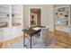 Comfortable home office space with built-in shelving and a desk at 15571 Bridgewater Club Blvd, Carmel, IN 46033