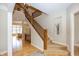 Inviting foyer with an elegant staircase, hardwood floors, and an open view to the living room at 15571 Bridgewater Club Blvd, Carmel, IN 46033
