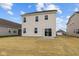 Rear view of home with a sliding glass door leading to the backyard at 1833 James Pierce Dr, Shelbyville, IN 46176