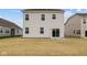 Rear view of home with a sliding glass door leading to the backyard at 1833 James Pierce Dr, Shelbyville, IN 46176