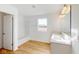 Bathroom featuring double vanity, bathtub with shower, and natural light at 1833 James Pierce Dr, Shelbyville, IN 46176