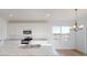 Bright white kitchen with modern appliances, a center island and hardwood floors at 1833 James Pierce Dr, Shelbyville, IN 46176