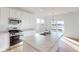 Bright white kitchen with modern appliances, a center island and hardwood floors at 1833 James Pierce Dr, Shelbyville, IN 46176