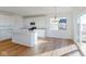 Bright white kitchen with modern appliances, a center island and sliding glass doors at 1833 James Pierce Dr, Shelbyville, IN 46176