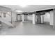 Unfinished basement has painted walls, gray flooring, and exposed ducts at 1429 Brookside Pkwy N Dr, Indianapolis, IN 46201