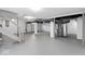 Spacious unfinished basement with exposed ductwork and painted white walls at 1429 Brookside Pkwy N Dr, Indianapolis, IN 46201