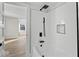 Modern bathroom featuring a tiled shower/tub combo with black hardware and a stylish niche at 1429 Brookside Pkwy N Dr, Indianapolis, IN 46201
