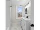 Bathroom with a white vanity, black hardware, subway tile, and a shower at 1429 Brookside Pkwy N Dr, Indianapolis, IN 46201