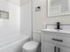 Updated bathroom with white subway tile backsplash and a modern vanity with black hardware at 1429 Brookside Pkwy N Dr, Indianapolis, IN 46201