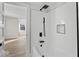 Updated bathroom boasts white subway tile shower with a modern, black shower head at 1429 Brookside Pkwy N Dr, Indianapolis, IN 46201