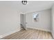 Bright bedroom with hardwood floors and a large window at 1429 Brookside Pkwy N Dr, Indianapolis, IN 46201