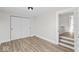 Light-filled bedroom with modern flooring and a closet at 1429 Brookside Pkwy N Dr, Indianapolis, IN 46201