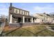 Charming two-story home featuring a large covered front porch, decorative shutters, and landscaped yard at 1429 Brookside Pkwy N Dr, Indianapolis, IN 46201