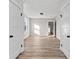 Hallway with wood-look floors, recessed lights, white trim, with connecting rooms at 1429 Brookside Pkwy N Dr, Indianapolis, IN 46201