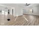 Spacious living room featuring hardwood floors, ample natural light, and a modern ceiling fan at 1429 Brookside Pkwy N Dr, Indianapolis, IN 46201