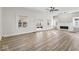 Bright living room with modern floors, fireplace, and expansive windows at 1429 Brookside Pkwy N Dr, Indianapolis, IN 46201