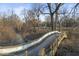 View from a bridge showing a public park with a playground on a sunny day at 1429 Brookside Pkwy N Dr, Indianapolis, IN 46201