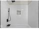 Close up of a modern shower stall, featuring white subway tiles and black trim at 1429 Brookside Pkwy N Dr, Indianapolis, IN 46201