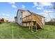 Spacious backyard deck with stairs leading to grassy yard at 4996 Hummingbird Dr, Brownsburg, IN 46112