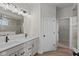 Double vanity bathroom with modern fixtures and a closet at 4996 Hummingbird Dr, Brownsburg, IN 46112