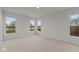 Spacious bedroom with multiple windows and carpet flooring at 4996 Hummingbird Dr, Brownsburg, IN 46112