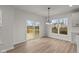 Bright dining room with hardwood floors and deck access at 4996 Hummingbird Dr, Brownsburg, IN 46112
