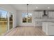 Dining area with hardwood floors and access to deck at 4996 Hummingbird Dr, Brownsburg, IN 46112