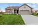 Brick and shingle ranch home with 2-car garage and landscaped lawn at 4996 Hummingbird Dr, Brownsburg, IN 46112