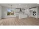 Open concept kitchen with island and stainless steel appliances at 4996 Hummingbird Dr, Brownsburg, IN 46112