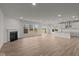 Open concept kitchen with island and stainless steel appliances at 4996 Hummingbird Dr, Brownsburg, IN 46112