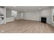 Bright living room featuring hardwood floors and fireplace at 4996 Hummingbird Dr, Brownsburg, IN 46112