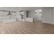 Open living area with hardwood floors and kitchen view at 4996 Hummingbird Dr, Brownsburg, IN 46112