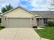 Charming single-story brick home with a well-maintained lawn and a two-car attached garage at 5445 Carnoustie Cir # 12A, Avon, IN 46123