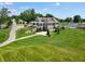 Expansive aerial view of a grand home with a large lawn, mature trees and manicured landscaping at 1433 Chatham Hills Blvd, Westfield, IN 46074