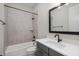 Bathroom boasts a tub/shower combo and stylish vanity with black hardware at 1433 Chatham Hills Blvd, Westfield, IN 46074