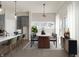 Bright dining area featuring kitchen island, stylish table setting and sheer curtains at 1433 Chatham Hills Blvd, Westfield, IN 46074