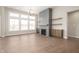 Spacious living room with fireplace, built-in shelves, and hardwood floors at 1433 Chatham Hills Blvd, Westfield, IN 46074
