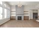 Bright living room with fireplace, built-in shelves, and large windows at 1433 Chatham Hills Blvd, Westfield, IN 46074