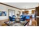 Cozy dining area featuring hardwood floors, a modern table, and plenty of natural light at 7178 Lockford N, Avon, IN 46123