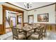 Elegant dining room features wood trim, wainscoting, neutral walls and a decorative chandelier at 7178 Lockford N, Avon, IN 46123