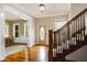 Grand entryway with hardwood floors and elegant staircase at 7178 Lockford N, Avon, IN 46123