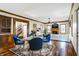 Inviting living area with an adjacent dining area, wood floors, fireplace, and natural light at 7178 Lockford N, Avon, IN 46123